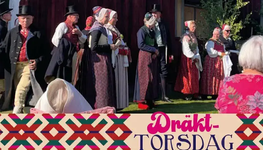 Människor i folkdräkt, OVansjö. Texten Dräkttorsdag på bilden.