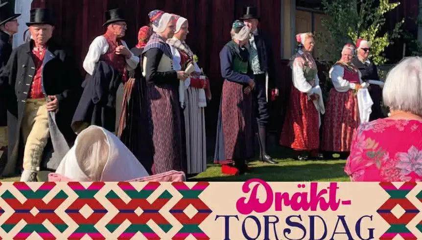 Människor i folkdräkt, OVansjö. Texten Dräkttorsdag på bilden.