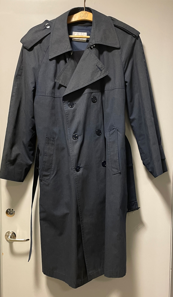 Trenchcoat i mörkblått från mitten av 1980-talet