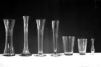 Sju blomvaser i olika storlekar och modeller.