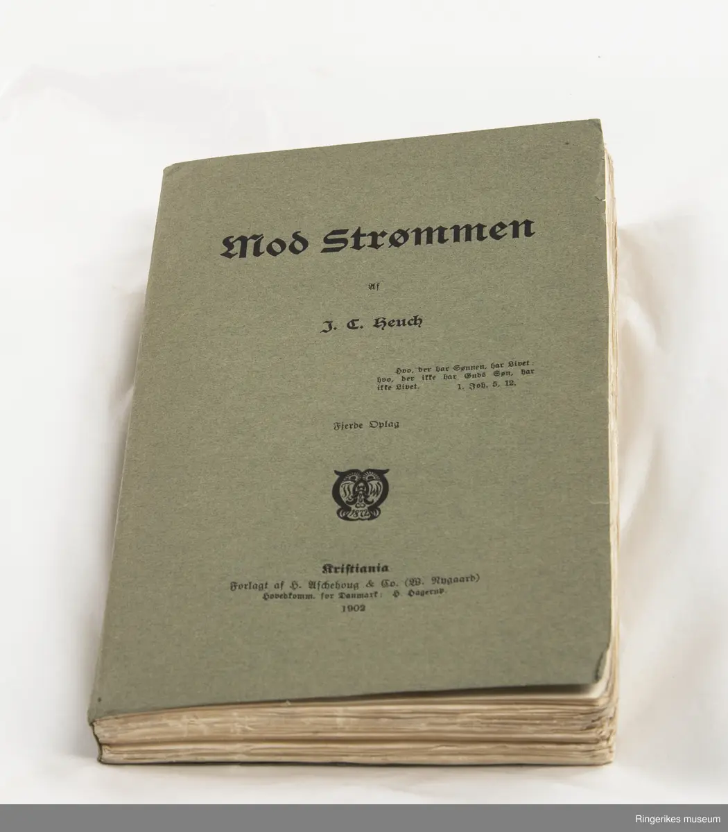 Svar skrevet av J. C. Heuch. Trykket i Kristiania i 1903. 212 sider.