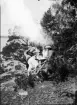 Män, kvinna och flicka runt kaffebordet på berget, Uppland