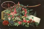 Gratulationskort med motiv av en vagn med blommor på framsidan. På baksidan adresserat till Ellen Sundberg.
