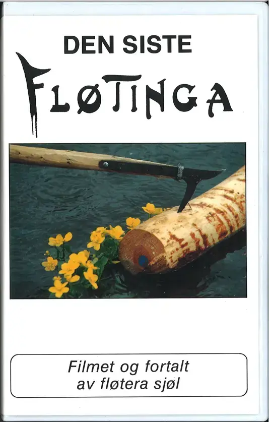 Vhs cover. BIlde av en tømmerstokk som ligger i vannkanten med fløterhake. 