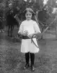 Född i Stockholm av okända föräldrar kom flickan Anna Margit ännu inte året fylld som fosterbarn till makarna Johan August och Ida Augusta Johansson i Norra Bråta. Född 1911 kan fototillfället uppskattas till omkring 1918.