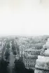 Vy över staden Paris med Eiffeltornet svagt synligt i bakgrunden, 1947 (enligt text i album).